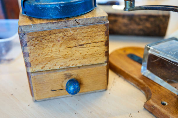 istock Vintage Coffee Mill And Accessories On A Wooden Table 1072674350