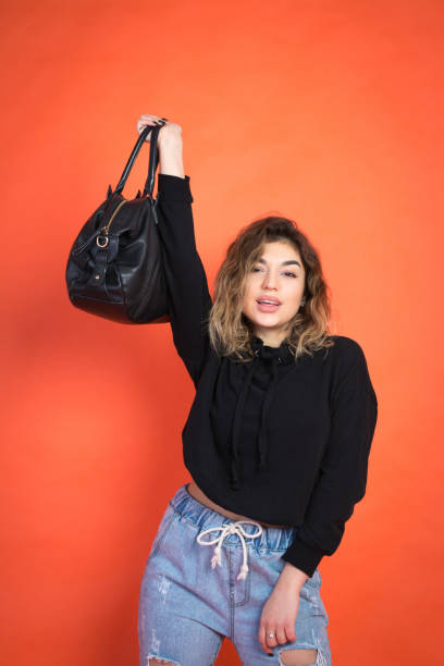 istock Shopping abstract: beautiful girl with a black bag 1072680290