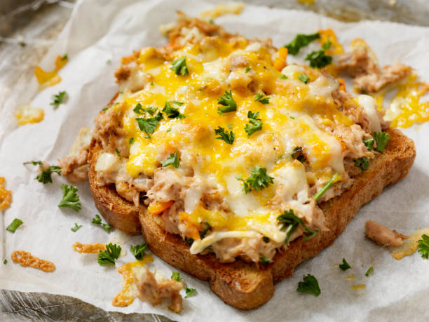 Tuna Melt on Toast Tuna Melt on Toast with Onions, Peppers and Parsley melting tuna cheese toast stock pictures, royalty-free photos & images