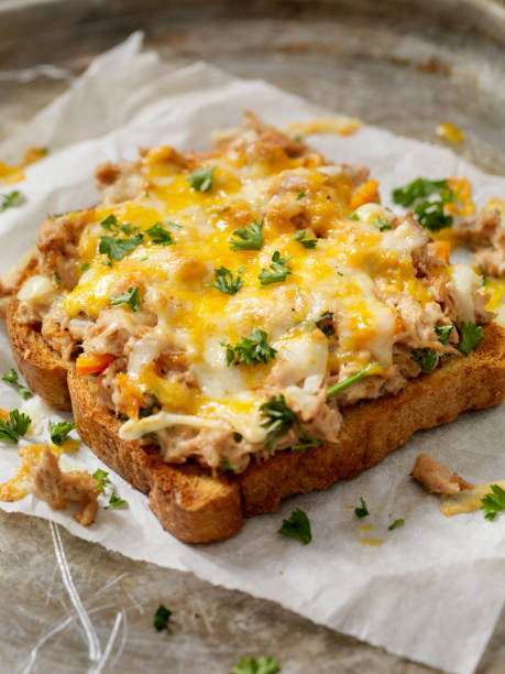 Tuna Melt on Toast Tuna Melt on Toast with Onions, Peppers and Parsley melting tuna cheese toast stock pictures, royalty-free photos & images