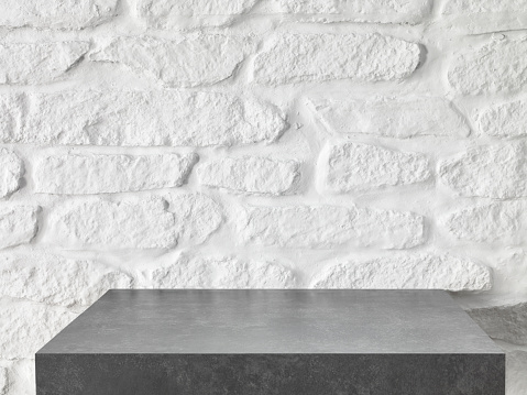 Marble table top in front of a rustic wall
