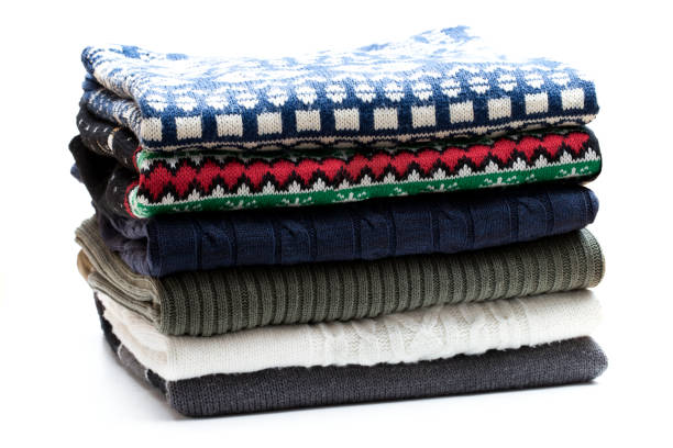istock Folded knitwear sweaters isolated on white 1072689658