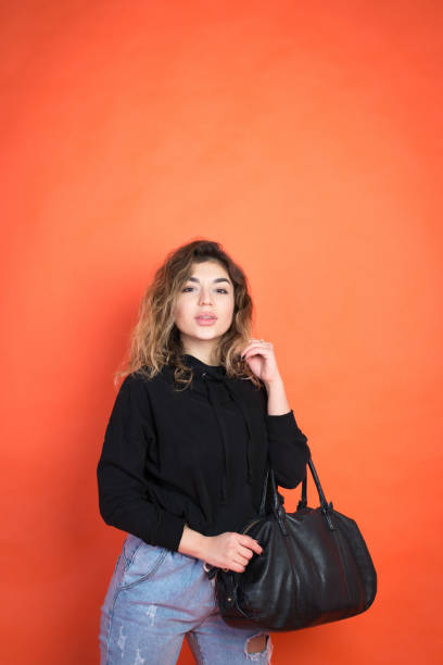 istock Shopping abstract: beautiful girl with a black bag 1072705118