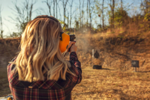 Woman practicing at a gun range