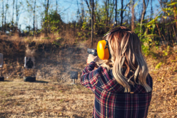 Woman practicing at a gun range