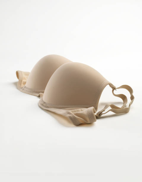 istock Beige bra lingerie isolated on white. 1072730610