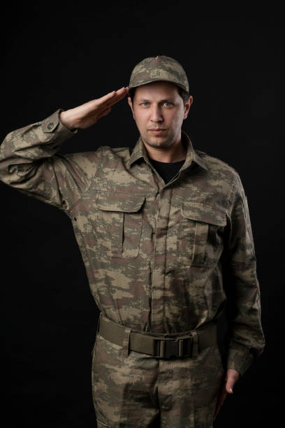 Male Soldier Portrait Male Soldier Portrait Over Black Background air force salute stock pictures, royalty-free photos & images