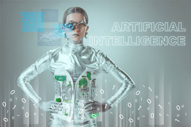 istock futuristic silver cyborg standing with hands on waist and looking at camera on grey with 