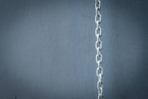 istock metal chain over retro painted wooden background 1072742526