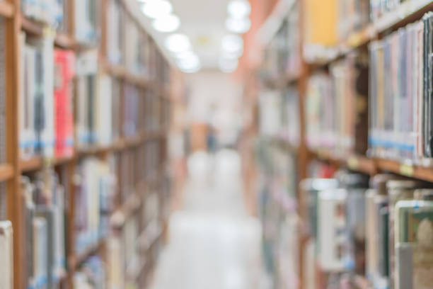 istock Blur school library or study room with book shelves for education background 1072752580