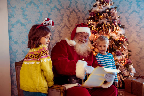 istock Santa Claus gives presents 1072753422
