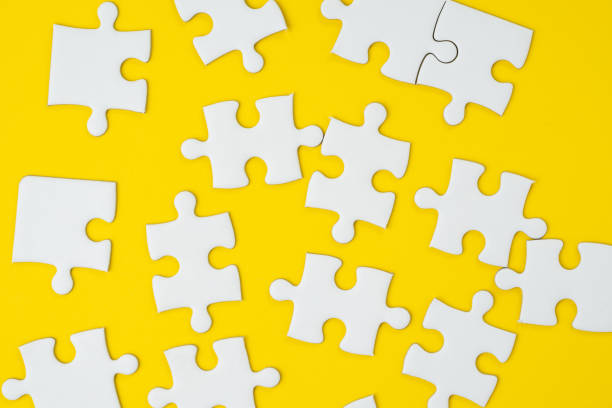 istock Business strategy for success metaphor or various solutions to solve problem concept, jigsaw puzzle pieces on yellow background 1072775954