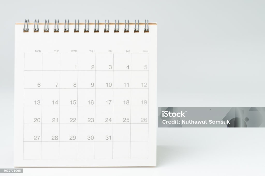 Clean white desktop calendar on white table with copy space, using for schedule appointment or year plan concept Clean white desktop calendar on white table with copy space, using for schedule appointment or year plan concept. Calendar Stock Photo