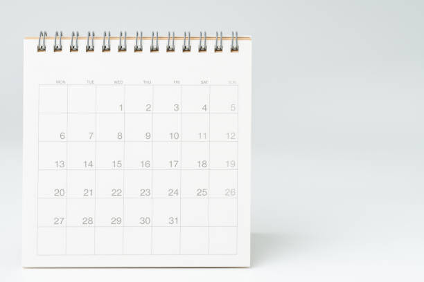 Clean white desktop calendar on white table with copy space, using for schedule appointment or year plan concept Clean white desktop calendar on white table with copy space, using for schedule appointment or year plan concept. monthly event photos stock pictures, royalty-free photos & images