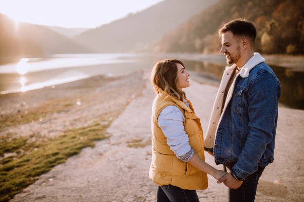 istock Passionate Young Couple Spending Time By Lake 1072786946