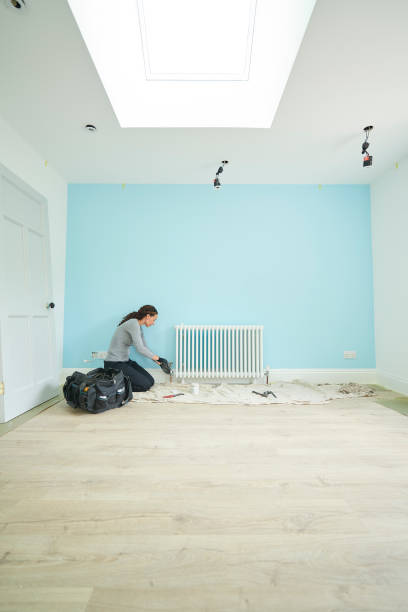 istock female plumber in new build 1072790660