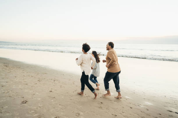 istock Barefoot running on the beach 1072792866