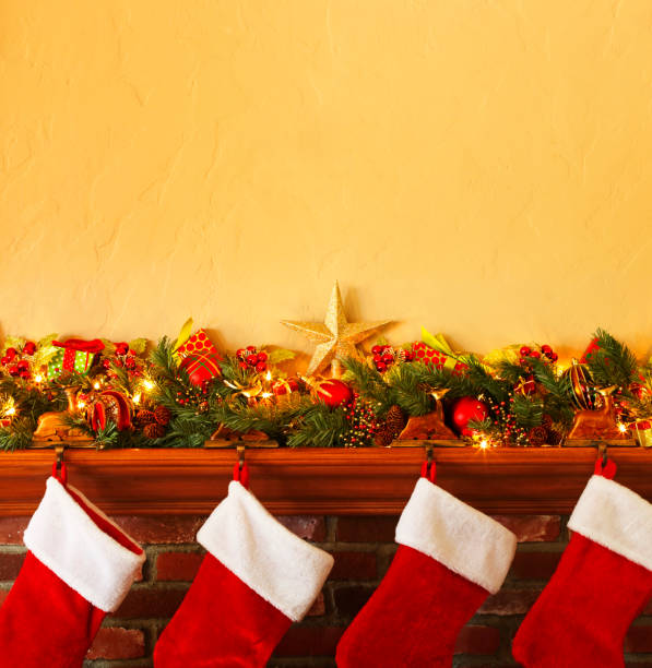 istock Four Stockings Hanging From A Christmas Mantelpiece 1072793494