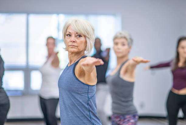 istock Seniors working out in a yoga class 1072799702