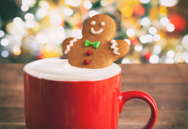 istock Christmas gingerbread man in hot chocolate on rustic wooden table 1072800102