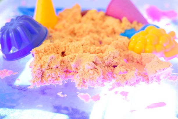 istock colored kinetic sand for kids 1072805170