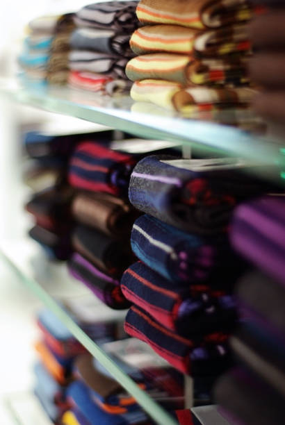 istock socks on glass shelves in a shop selective focus 1072807978