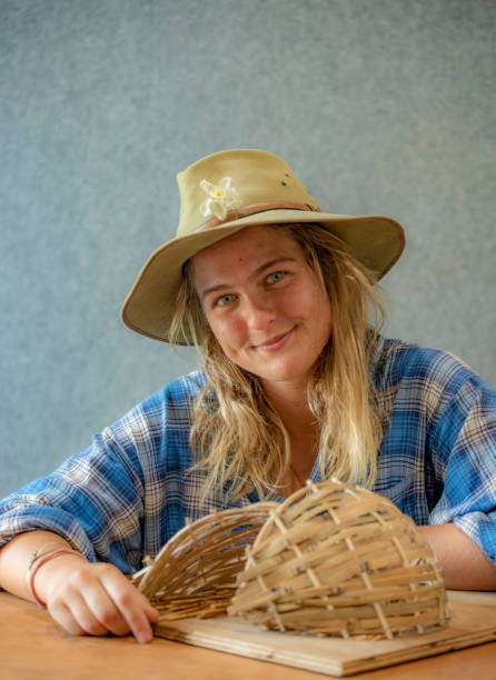 istock attractive Australian young woman smiling about  her woven bamboo structure. 1072809734
