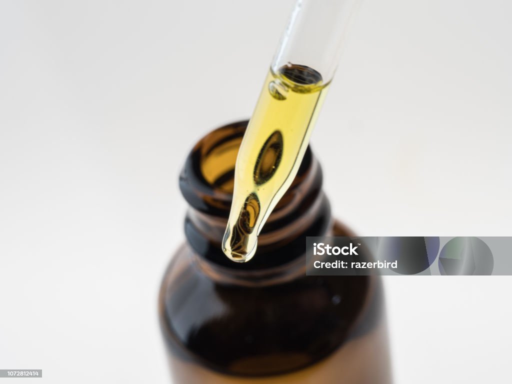 Container with CBD oil, cannabis live resin extraction isolated on white - medical marijuana concept close-up Crude Oil Stock Photo