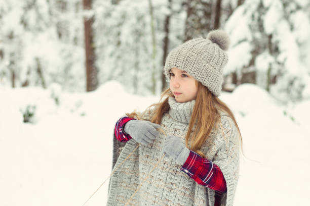 istock Little Girl Playing in the Snow 1072829364