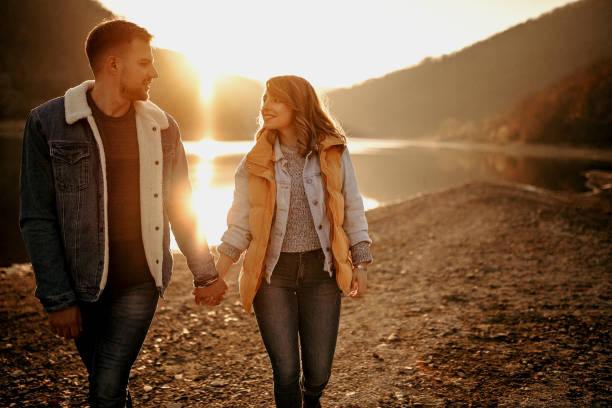 istock Young couple walking on sunshine 1072834130