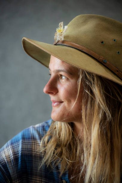 istock attractive smiling Australian young woman in hat observing off camera. 1072840020