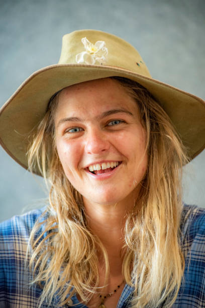 istock attractive laughing Australian young woman with hat looking into camera. 1072840614