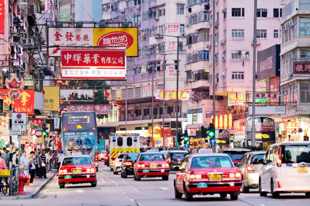 istock Neon lights and traffic in Jordan district Hong Kong 1072855592