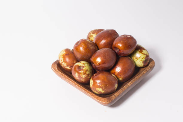 Jujube fruits close up on white.