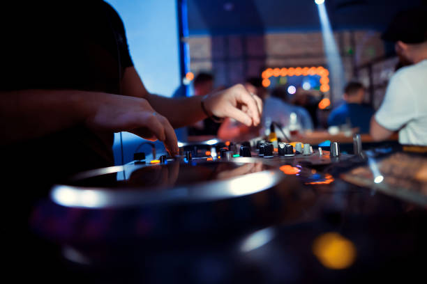 istock DJ entertaining a crowd in a party tent. 1072856852