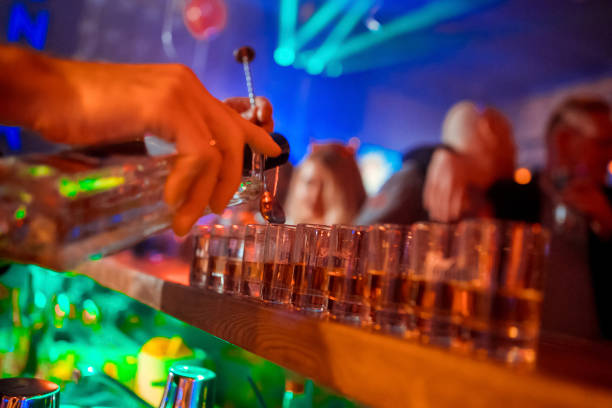 istock Bartender is pouring tequila into glass 1072859234