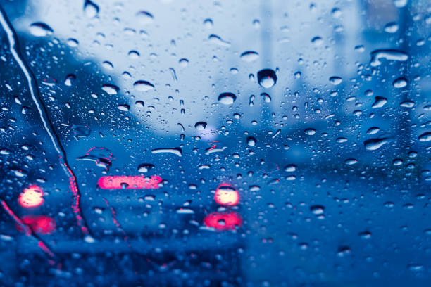 istock raining when driving a car on the road storm wet moist 1072859648