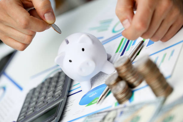 Hand businessman putting pin money