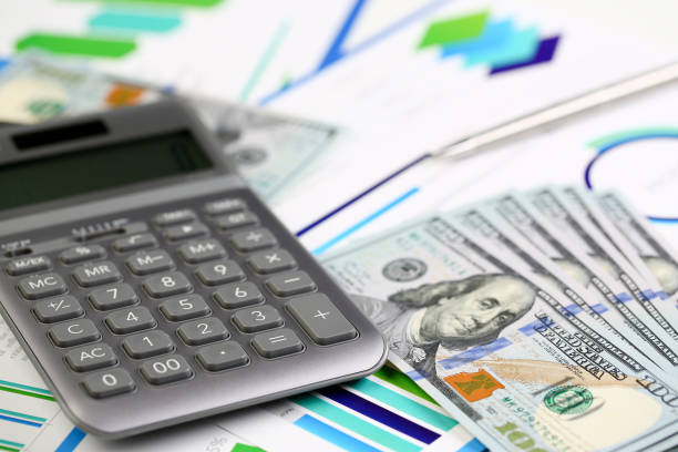 istock Silver calculator with gray keyboard is lying 1072865866