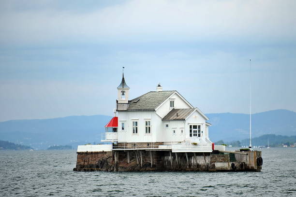 The evening view of a lighthouse near Averoeya island in Norway