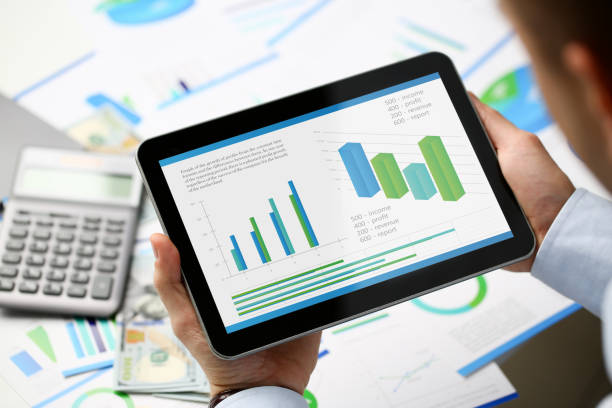istock Businessman holding tablet in hands with 1072872140