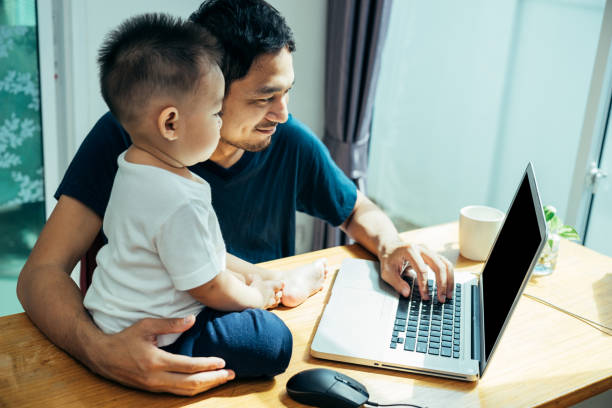 istock Asian father and his son is using the laptop computer 1072872474