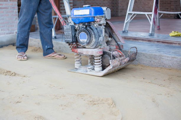 istock Worker use vibratory plates seals the base sand 1072875764