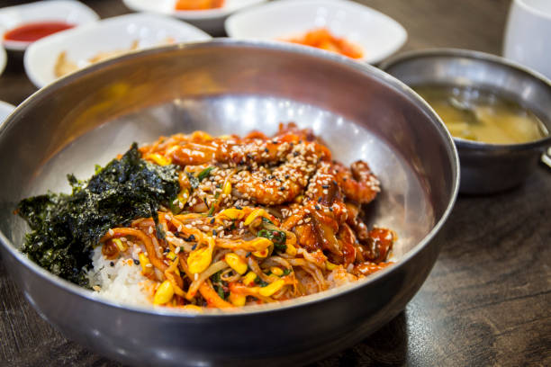 Rice with Stir-fried Octopus  seasoned gochujang - Korean Food Nakji Bokkeum Deopbap, Rice with Stir-fried Octopus with gojugang banchan stock pictures, royalty-free photos & images