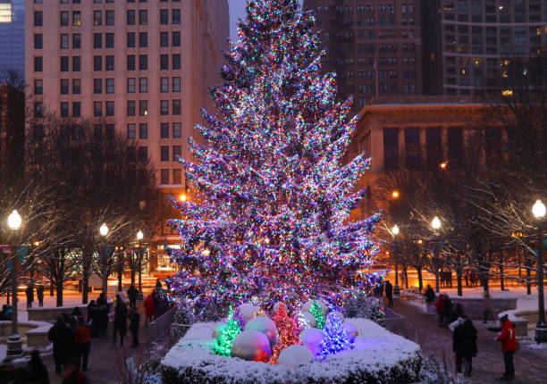 This Snow Covered Christmas Tree stands out brightly against the dark blue tones of this snow covered scene.