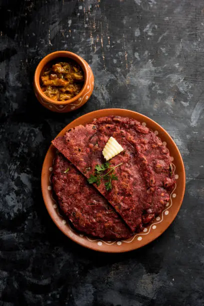 Photo of Ragi Roti made from finger millet from India is extremely rich in proteins served with pickle or achar. selective focus