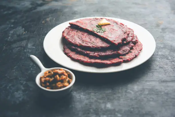 Photo of Ragi Roti made from finger millet from India is extremely rich in proteins served with pickle or achar. selective focus