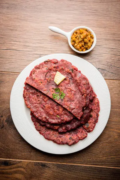 Photo of Ragi Roti made from finger millet from India is extremely rich in proteins served with pickle or achar. selective focus