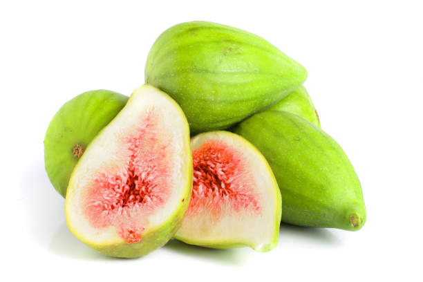 istock Ripe green fig fruit and half isolated on white background 1072901536