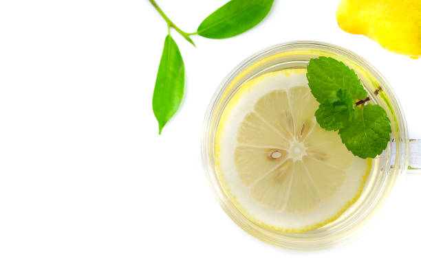 istock Healthy lemon juice in a glass on a white background. 1072902284